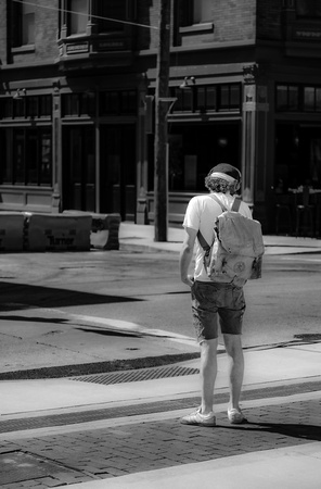 Young man with backpack, Vine Street